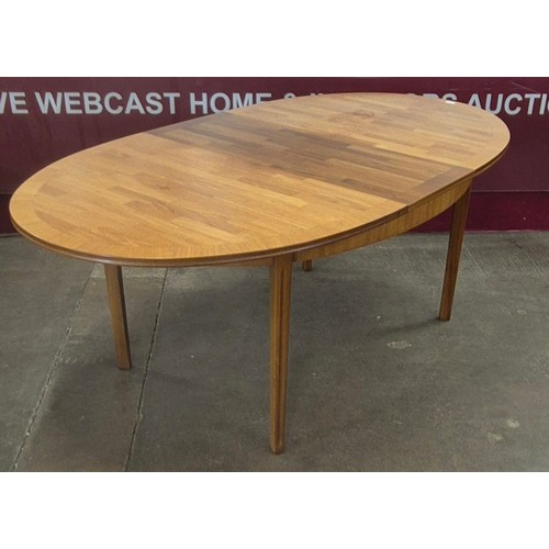 66 - A William Lawrence teak oval extending dining table and six chairs