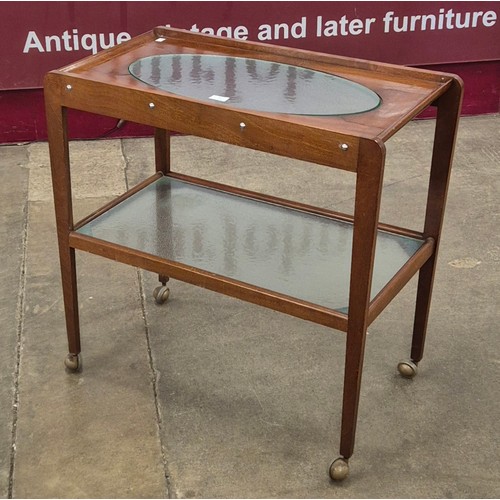 71 - A teak and glass topped two tier cocktail trolley