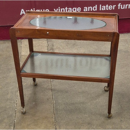 71 - A teak and glass topped two tier cocktail trolley