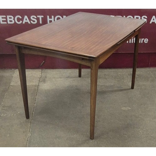 79 - A Younger Volnay afromosia extending dining table and six chairs, designed John Herbert