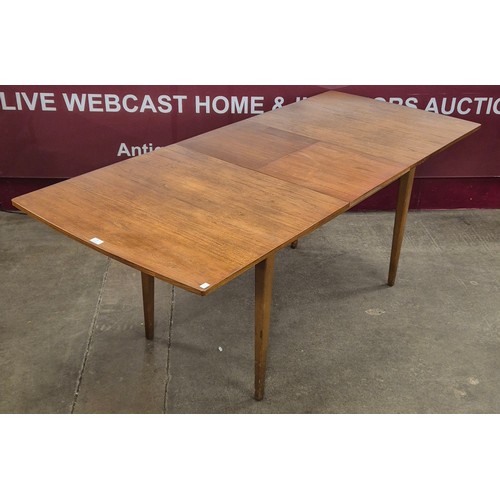 83 - A Nathan teak rectangular extending dining table and six chairs