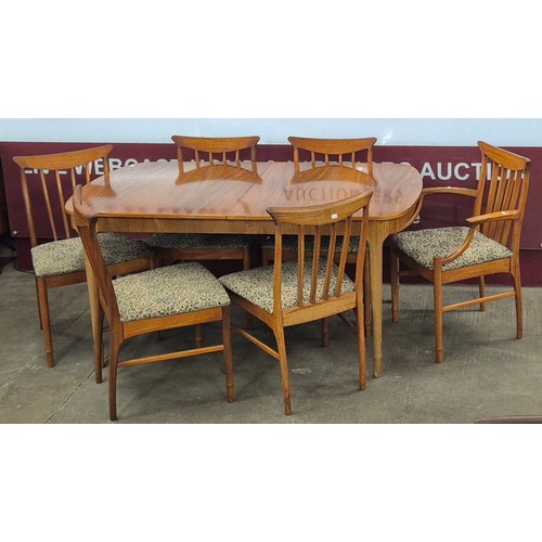 87 - A McIntosh teak rectangular extending dining table and six chairs