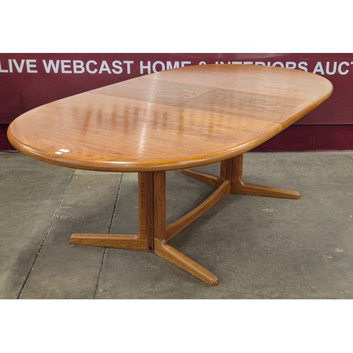 89 - A Danish teak oval extending dining table and a set of six Erik Buch dining chairs