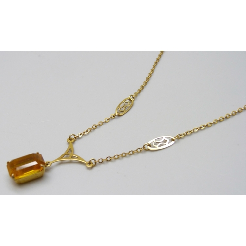 7019 - A 9ct gold necklace set with an orange paste stone, chain a/f, 3g