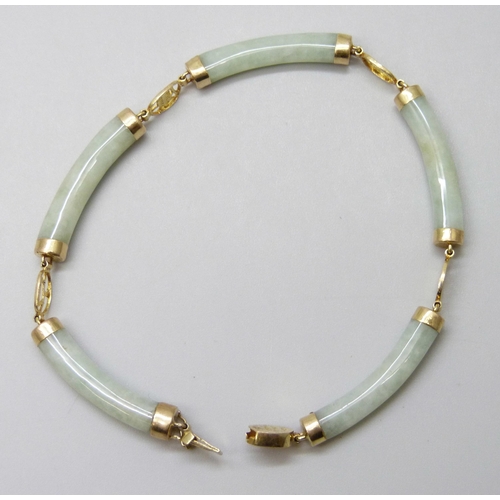 7020 - A Chinese 14ct gold and jade coloured stone bracelet, 10.5g, 19cm