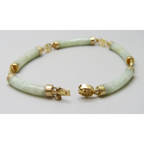 7020 - A Chinese 14ct gold and jade coloured stone bracelet, 10.5g, 19cm