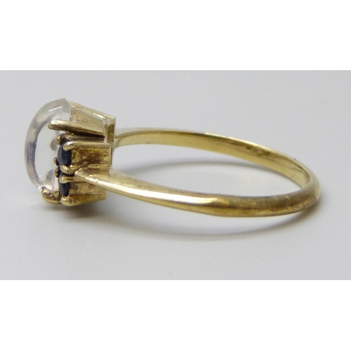 7023 - A .800 silver gilt moonstone and sapphire ring, P