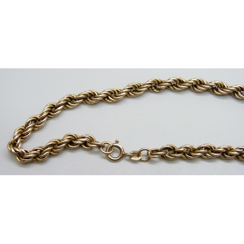 7025 - A 9ct yellow gold rope chain necklace, 17.9g, 67cm