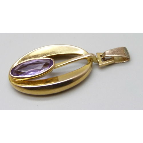 7028 - A 9ct gold amethyst set pendant, 3.4g, 4.1cm including bale