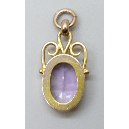 7033 - A 9ct gold mounted amethyst pendant, 2.2g, 2.4cm