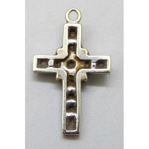 7034 - A white and yellow metal diamond set cross pendant, 1.9g, 2.1cm, lacking bale