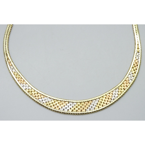 7040 - An 18ct three tone gold textured necklace, 49g, 42cm