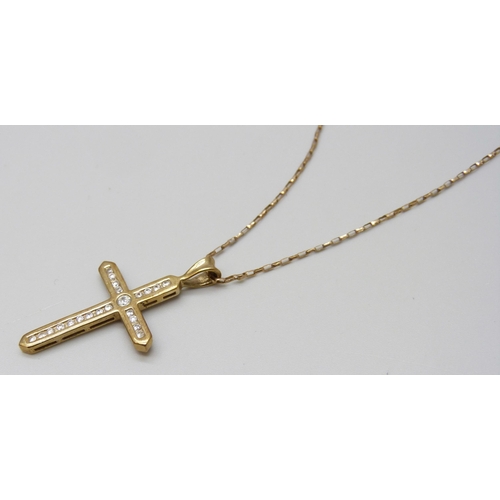 7046 - A 9ct gold cubic zirconia set cross pendant on chain, 3.5g, 3.7cm pendant