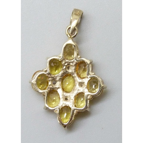 7057 - A 9ct gold pendant set with yellow and white stones, 2g, 2.7cm including bale