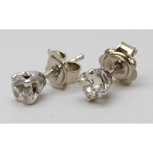 7063 - A pair of 18ct white gold diamond stud earrings, total diamond weight 0.92ct