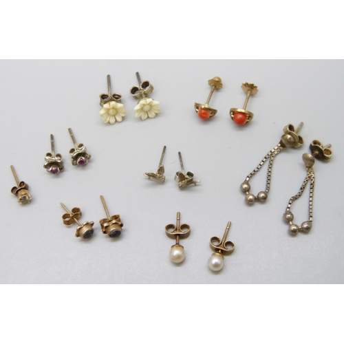 7068 - A collection of earrings including three yellow metal pairs, 2g