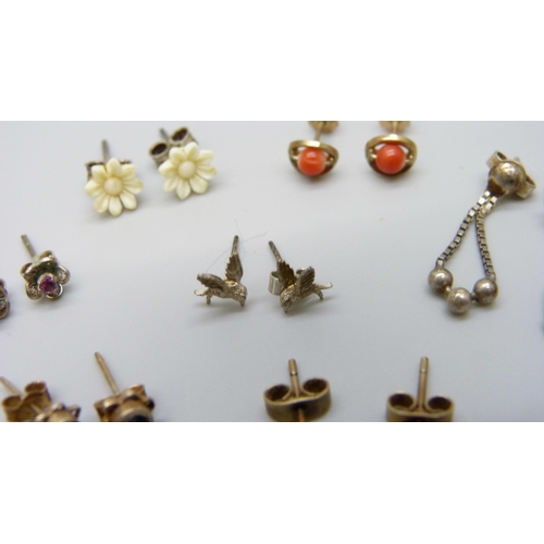 7068 - A collection of earrings including three yellow metal pairs, 2g