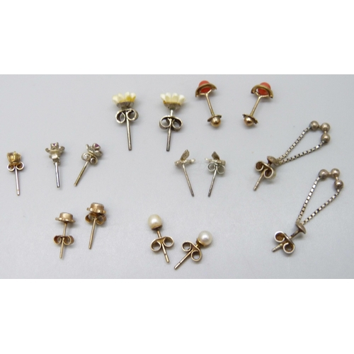 7068 - A collection of earrings including three yellow metal pairs, 2g