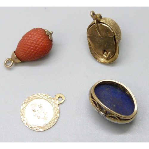 7074 - A 9ct gold jockey's cap charm opening to reveal a horse's head, 3.9g, a yellow metal charm with Arab... 