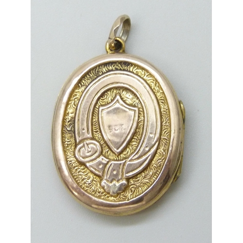 7089 - A Victorian 9ct gold locket with enamelled Art Nouveau floral design and buckle detail verso, 7.2g, ... 