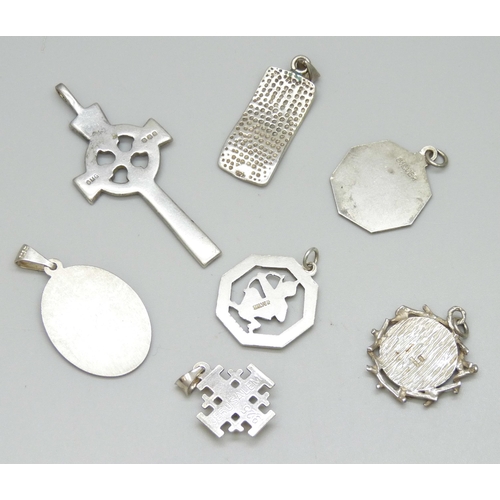 7105 - Seven silver pendants including St Christophers, and an Ola Gorie cross pendant, 30g