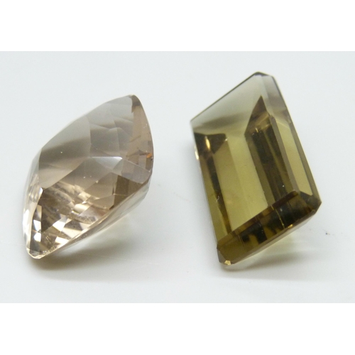 7106 - Two large citrines/smoky quartz, total weight 97 carats, slight chip to two corners