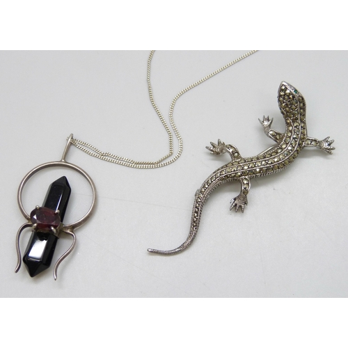 7107 - A silver lizard brooch, and an unmarked gemstone set spider pendant with silver chain, 19g total, li... 