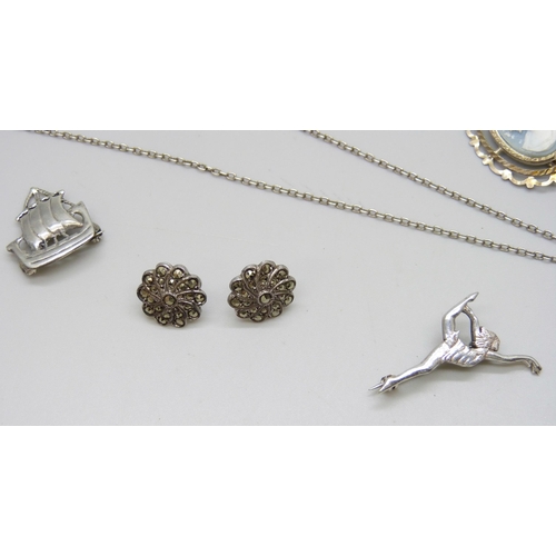 7110 - A collection of silver jewellery including a butterfly wing pendant, chain, brooches, etc., all test... 