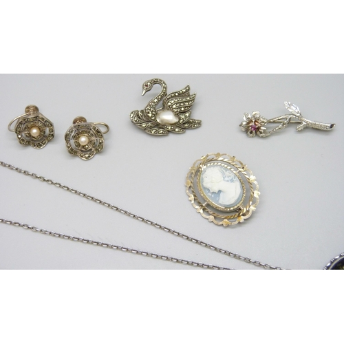 7110 - A collection of silver jewellery including a butterfly wing pendant, chain, brooches, etc., all test... 