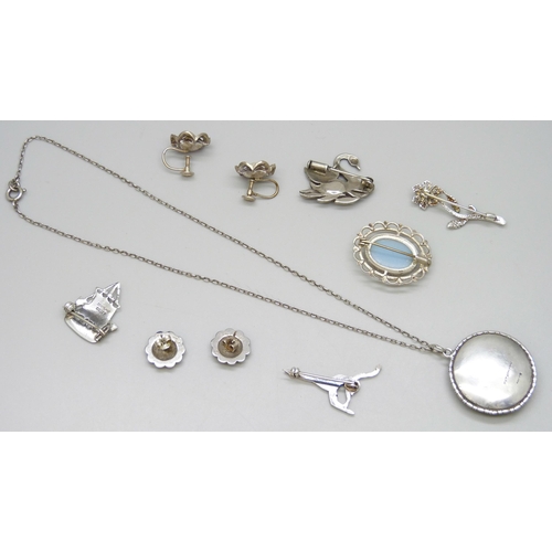 7110 - A collection of silver jewellery including a butterfly wing pendant, chain, brooches, etc., all test... 