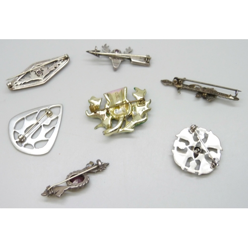 7129 - A collection of seven Scottish style brooches, five silver and two costume, 25g of silver