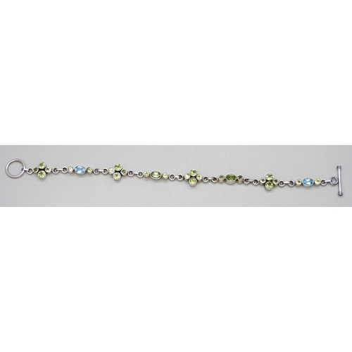 7130 - A silver blue and green stone set bracelet, 19.5cm, 10.2g