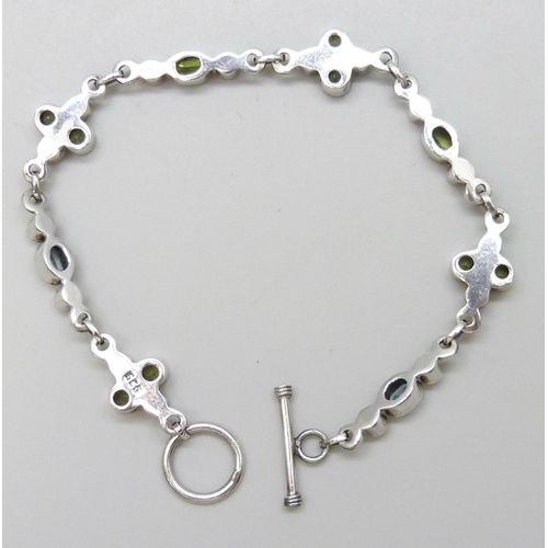 7130 - A silver blue and green stone set bracelet, 19.5cm, 10.2g