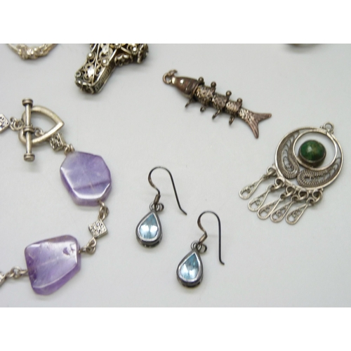 7146 - A collection of jewellery including two pairs of silver earrings, a silver pendant, and a silver bra... 