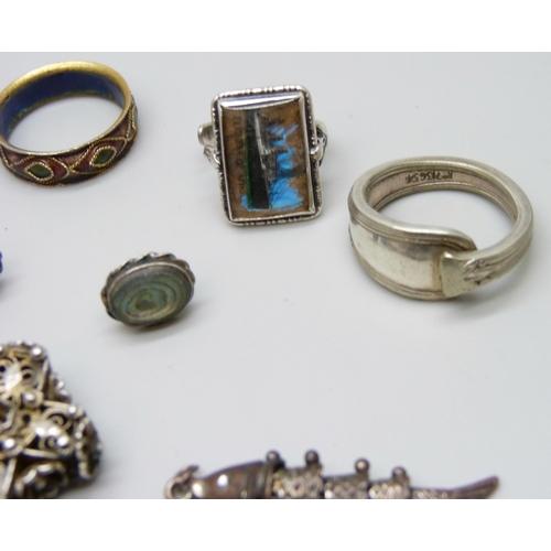 7146 - A collection of jewellery including two pairs of silver earrings, a silver pendant, and a silver bra... 