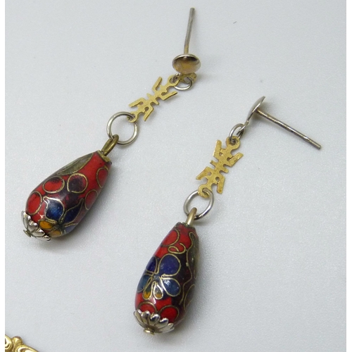 7149 - A gilt metal turquoise set pendant, a pair of Chinese cloisonne earrings, and a lapel clip