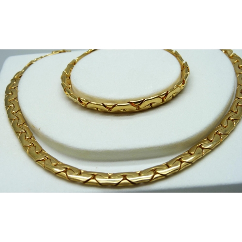 7150 - A Givenchy Serpentine necklace and bracelet set, in original box