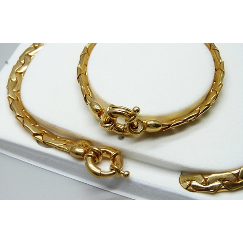 7150 - A Givenchy Serpentine necklace and bracelet set, in original box