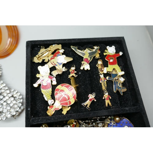 7167 - A box of costume jewellery, a tray of earrings and badges