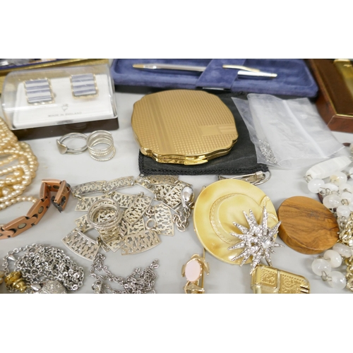 7172 - A box of mixed jewellery, lighters, wristwatches, pens including stone set brooches, bangle and pin ... 