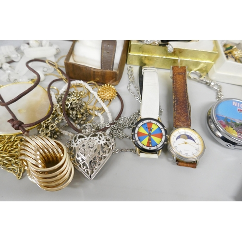 7172 - A box of mixed jewellery, lighters, wristwatches, pens including stone set brooches, bangle and pin ... 