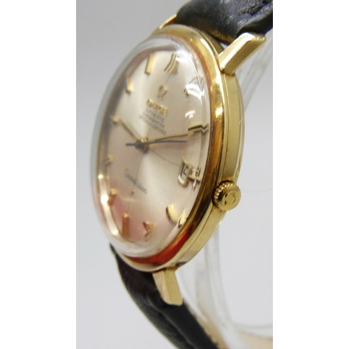 7179 - A 1964 18ct gold Dennison cased Omega Constellation wristwatch with original period Omega buckle on ... 