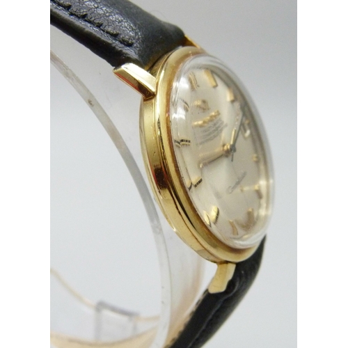 7179 - A 1964 18ct gold Dennison cased Omega Constellation wristwatch with original period Omega buckle on ... 