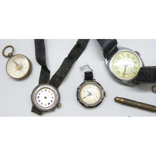 7180 - Two silver wristwatches, three others, a compass and pocket watch keys