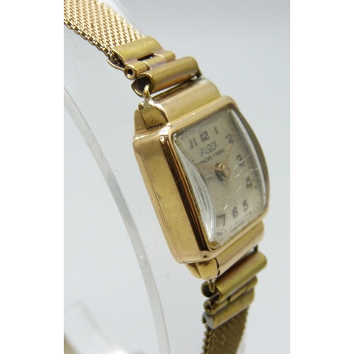 7181 - An 18ct gold cased lady's wristwatch on a plated strap, 17mm including crown