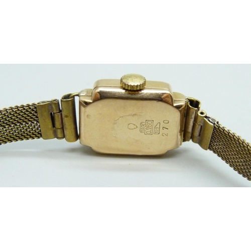 7181 - An 18ct gold cased lady's wristwatch on a plated strap, 17mm including crown