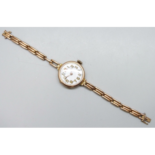 7188 - A 9ct gold cased wristwatch on a 9ct gold strap, 28mm including crown, 21g total weight