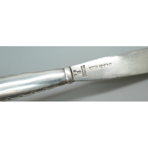 7238 - A silver Georg Jensen preserve knife, London 1934 import Mark, 2g, 134mm