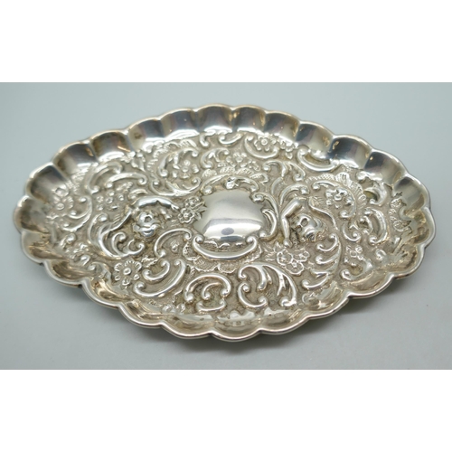 7241 - A Victorian silver embossed tray, Birmingham 1898, 35g, (a/f, one small hole), 11.8cm