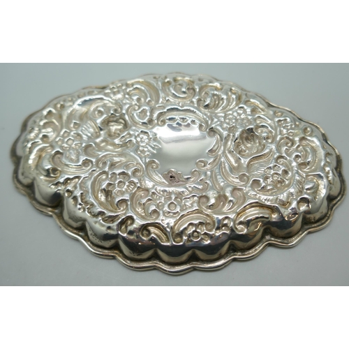 7241 - A Victorian silver embossed tray, Birmingham 1898, 35g, (a/f, one small hole), 11.8cm